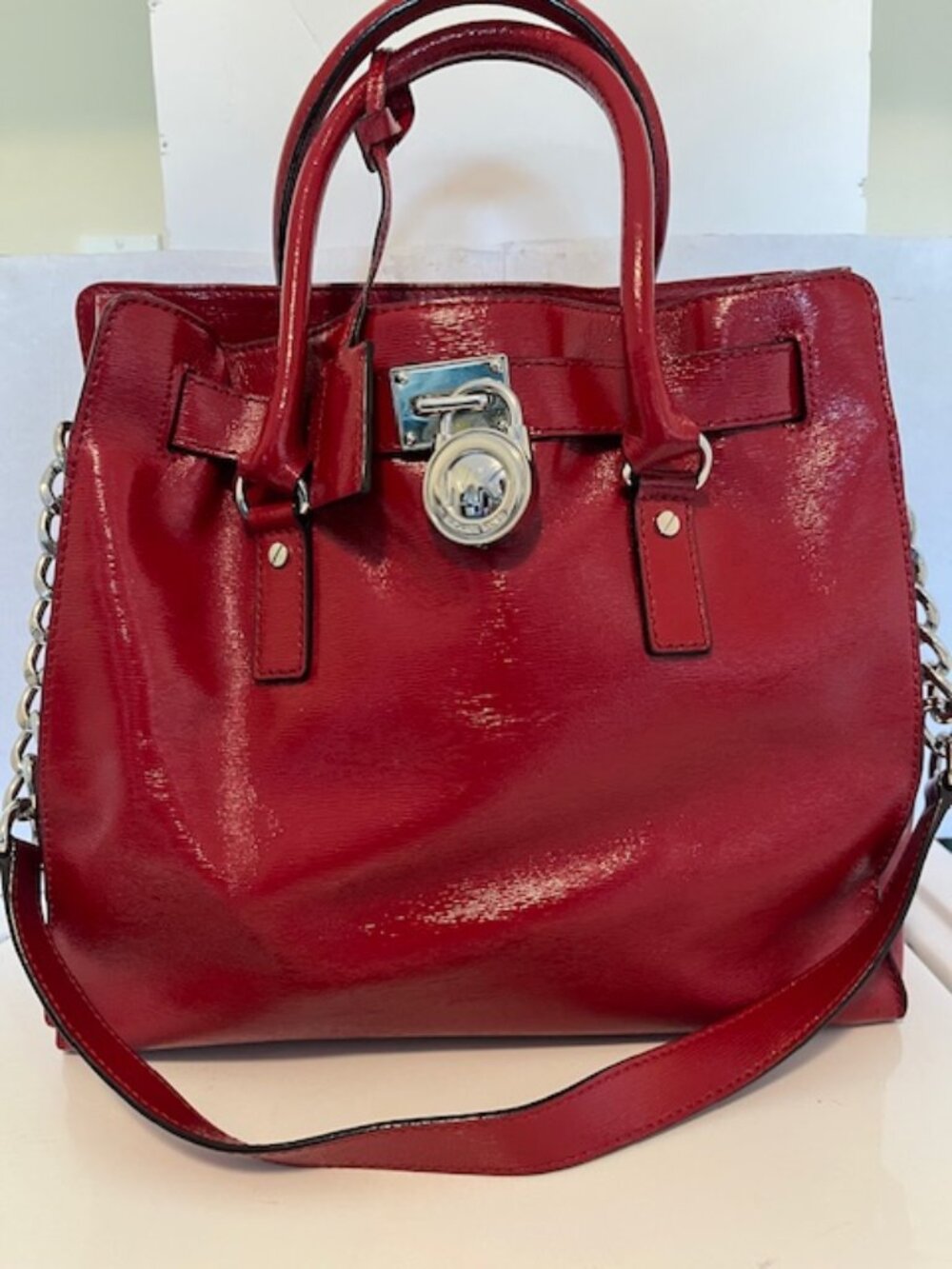 Michael Kors patent leather satchel bag.
